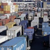 Loaded container trucks line-up at a gate at the Port of Seattle, Tuesday, Feb. 17, 2015, in Seattle.