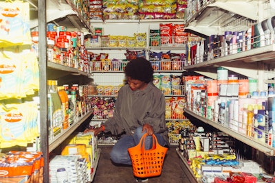Black Woman Selecting Products For Buying In Supermarket 4177709