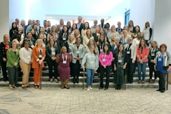 Attendees pose for a group photo.