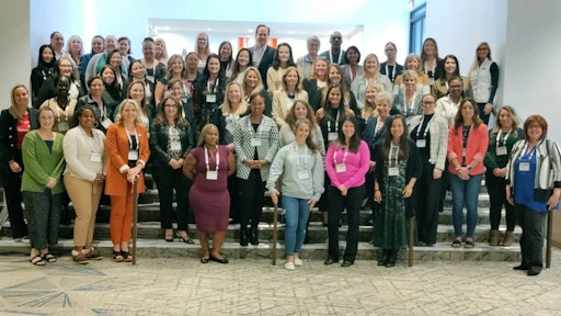 Attendees pose for a group photo.