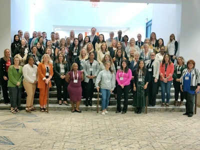 Attendees pose for a group photo.