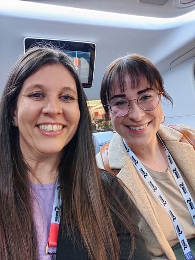 Marina Mayer, editor-in-chief, and Alexis Mizell-Pleasant, managing editor, sit in a driverless car.