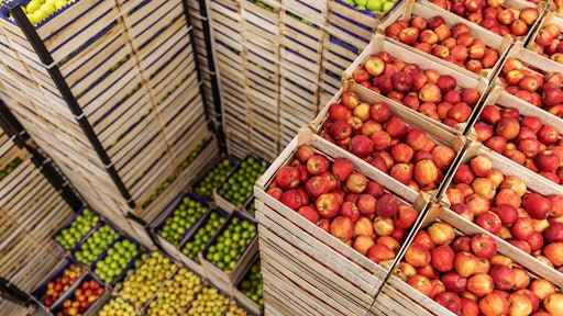 Perishable fruit and vegetables stacked for warehousing.