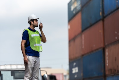 An employee coordinates a shipment.