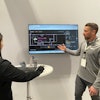 Editor-in-Chief Marina Mayer (left) demos the Yale Relay live at ProMat 2025, with instruction from Kyle Smart, sales manager, emerging technology, Yale Lift Truck Technologies.