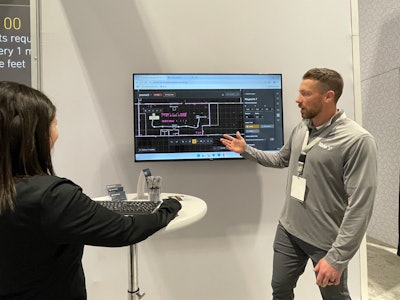 Editor-in-Chief Marina Mayer (left) demos the Yale Relay live at ProMat 2025, with instruction from Kyle Smart, sales manager, emerging technology, Yale Lift Truck Technologies.