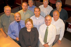 The Sourcing Team at Kimball's International Office: 1st row (left to right) — Jane Vogler, John Barwe 2nd row — Glynn Staten, Bob Price, Ben Russell 3rd row — Myron Lampert, Rob Young, Stan Schneider, Werner Bender, Larry Quade Missing from photo: Lara Dickerson