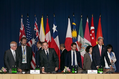 FILE - In this Oct. 8, 2013, file photo, U.S. Secretary of State John Kerry, front right, and New Zealand Prime Minister John Key, front second left, arrive for the Trans-Pacific Partnership meet in Bali, Indonesia.