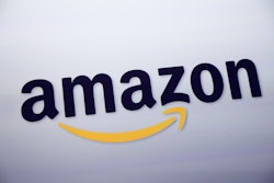 FILE - This Sept. 28, 2011 file photo shows the Amazon logo on display at a news conference in New York. Rumors of an Amazon smartphone reached a fever pitch this week, with several tech blogs speculating that the device could be due out this year. (AP Photo/Mark Lennihan, File)
