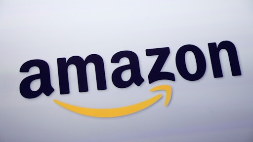 FILE - This Sept. 28, 2011 file photo shows the Amazon logo on display at a news conference in New York. Rumors of an Amazon smartphone reached a fever pitch this week, with several tech blogs speculating that the device could be due out this year. (AP Photo/Mark Lennihan, File)