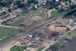 This April 18, 2013 file photo shows an aerial view of the remains of a fertilizer plant and an apartment complex to the left, destroyed by an explosion in West, Texas. The government has failed to inspect virtually all of the chemical facilities that it considers to be at high risk for a terror attack, numbering in the thousands, and has underestimated the threat to densely populated cities, congressional investigators say. (AP Photo/Tony Gutierrez, File)
