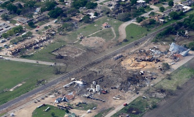 This April 18, 2013 file photo shows an aerial view of the remains of a fertilizer plant and an apartment complex to the left, destroyed by an explosion in West, Texas. The government has failed to inspect virtually all of the chemical facilities that it considers to be at high risk for a terror attack, numbering in the thousands, and has underestimated the threat to densely populated cities, congressional investigators say. (AP Photo/Tony Gutierrez, File)