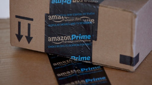 This June 4, 2014 photo shows Amazon.com boxes in Phoenix. Amazon reports quarterly financial results on Thursday, July 24, 2014. (AP Photo/Ross D. Franklin)