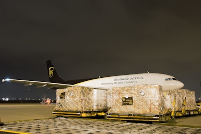 A UPS plane with nearly 100,000 pounds of American Red Cross relief supplies prepares to take off from Dallas/Fort Worth International.