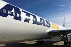 Atlas will take a $100 million charge against fiscal fourth quarter earnings, though will make three installment payments by 2018 to settle the charges brought by dozens of air cargo customers ranging from General Electric Co. to the parent of Crate & Barrel.