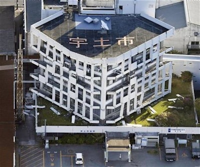 Exterior wall of the city hall fall off after the earthquake in Uto, Kumamoto prefecture, southern Japan Saturday, April 16, 2016. A powerful earthquake struck southern Japan early Saturday, barely 24 hours after a smaller quake hit the same region.