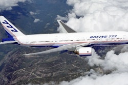 Boeing 777 above clouds crop 58a72553a6c6f