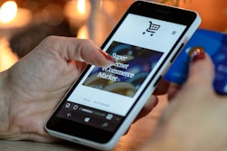 Person Using Black And White Smartphone And Holding Blue 230544