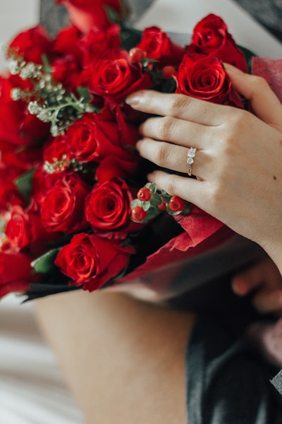 Person Holding Bouquet Of Red Roses 1315921
