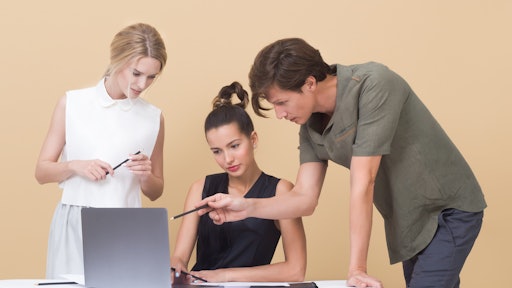 Two Woman And One Man Looking At The Laptop 1036641