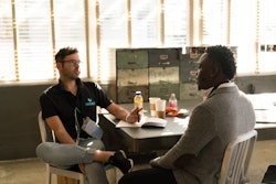 Man Wearing Black Polo Shirt And Gray Pants Sitting On White 935977 (1)