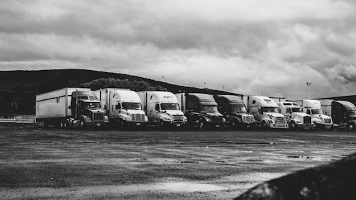 Parked Trucks Under Clouds 2348359