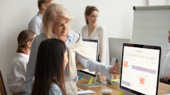 Stock Meeting In Front Of Computer