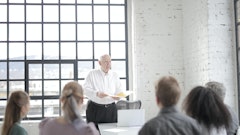 Diverse Colleagues Listening To Senior Male Executive At 3861571