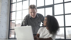 Focused Multiracial Coworkers Of Different Age Using Laptop 3865844