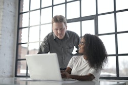 Focused Multiracial Coworkers Of Different Age Using Laptop 3865844