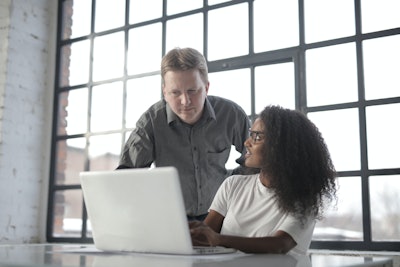 Focused Multiracial Coworkers Of Different Age Using Laptop 3865844