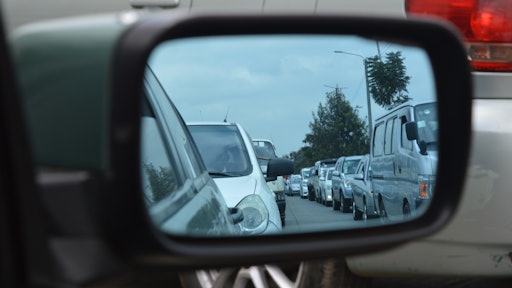 Car Side Mirror Showing Heavy Traffic 191842
