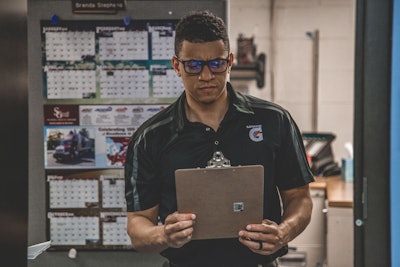 Man Holding Clipboard Inside Room 1543924 (1)