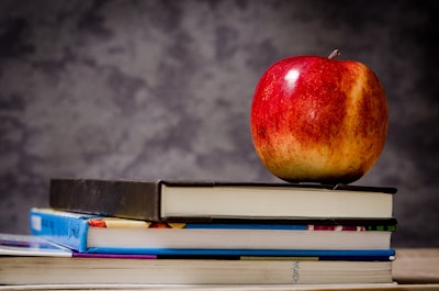 Close Up Of Apple On Top Of Books 256520