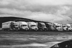 Parked Trucks Under Clouds 2348359