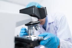 Scientist Using Microscope 3938022