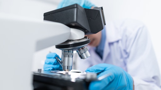 Scientist Using Microscope 3938022