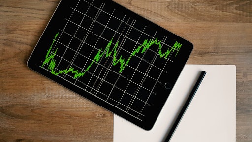 Space Grey Ipad Air With Graph On Brown Wooden Table 187041
