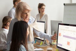 Stock Meeting In Front Of Computer