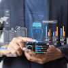 Business professional holding smartphone displaying digital analytics dashboard with charts, graphs, and procurement metrics
