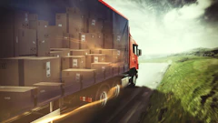 Red delivery truck loaded with cardboard boxes driving on highway with green landscape and dramatic sky