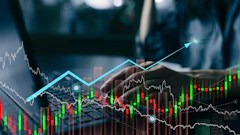 Financial stock market charts with candlestick graphs, upward trend lines, and trading data visualization on blurred business background