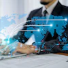 Businessman using laptop with AI technology visualization, digital world map, and data network connections
